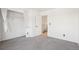 Bedroom featuring neutral carpet, an open closet, and a window at 8975 Field St # 39, Broomfield, CO 80021