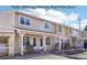 Charming condo with beige siding, covered entry, and well-maintained landscaping at 8975 Field St # 39, Broomfield, CO 80021