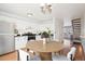 Eat-in kitchen with stainless steel appliances, white cabinetry and natural light at 8975 Field St # 39, Broomfield, CO 80021
