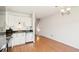 Contemporary kitchen with white cabinetry, stainless steel appliances, and ample lighting at 8975 Field St # 39, Broomfield, CO 80021