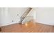 Bright living room with hardwood flooring, staircase, and ample space at 8975 Field St # 39, Broomfield, CO 80021