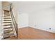 Light-filled living room features hardwood floors and staircase at 8975 Field St # 39, Broomfield, CO 80021