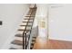 View of the staircase, with black metal railing, and light wood floors at 8975 Field St # 39, Broomfield, CO 80021