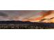 Community view with the mountains, colorful sunset, and dark clouds in the background at 8661 Hunters Hill Ln, Littleton, CO 80125