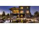 Stunning backyard with pond, hot tub, covered deck, and multi-level landscaping at 8661 Hunters Hill Ln, Littleton, CO 80125