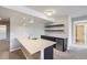 Stylish bar area featuring a sink, modern lighting, floating shelves, and a mini fridge at 8661 Hunters Hill Ln, Littleton, CO 80125