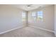 Empty bedroom with neutral walls and carpet, ceiling fan, and good natural light at 8661 Hunters Hill Ln, Littleton, CO 80125
