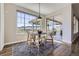Dining area with sliding doors and window views of the mountain landscape at 8661 Hunters Hill Ln, Littleton, CO 80125