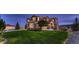 Sprawling two-story home boasts mature landscaping, stone accents, and charming craftsman-style details at 8661 Hunters Hill Ln, Littleton, CO 80125