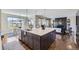 Kitchen featuring a large island, stainless appliances, and mountain views at 8661 Hunters Hill Ln, Littleton, CO 80125