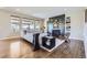 Bright living room features a fireplace, custom built-ins, and mountain views at 8661 Hunters Hill Ln, Littleton, CO 80125