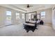 Bright main bedroom with ceiling fan, carpet floors, tray ceilings and mountain views at 8661 Hunters Hill Ln, Littleton, CO 80125