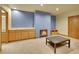 Finished basement featuring a wet bar, fireplace, and neutral carpeting, ready for entertaining at 6321 S Harrison Ct, Centennial, CO 80121