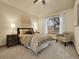 Serene bedroom featuring a soft color palette, plush carpet, and a cozy sitting area at 6321 S Harrison Ct, Centennial, CO 80121