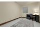 Spare bedroom featuring a desk, chair, and a window for natural light at 6321 S Harrison Ct, Centennial, CO 80121