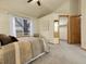 Bright bedroom showcasing a large window and an open closet area at 6321 S Harrison Ct, Centennial, CO 80121