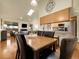 Open-concept dining room with skylight connected to the living room and kitchen at 6321 S Harrison Ct, Centennial, CO 80121