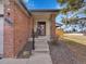 Inviting front porch with brick accents and space for seating at 6321 S Harrison Ct, Centennial, CO 80121