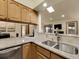 Updated kitchen with granite countertops, open to the living spaces at 6321 S Harrison Ct, Centennial, CO 80121