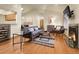 Open living space features hardwood floors, vaulted ceilings, and a modern fireplace at 6321 S Harrison Ct, Centennial, CO 80121