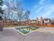 Community pool surrounded by trees and multiple residential properties at 6321 S Harrison Ct, Centennial, CO 80121