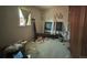 Bedroom with clutter, a bed frame, and natural light from a window at 240 N 4Th Ave, Brighton, CO 80601