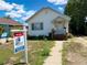 View of house with For Sale sign in the front yard at 240 N 4Th Ave, Brighton, CO 80601