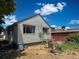 Home exterior with siding offers an outside eating space and yard for relaxing at 240 N 4Th Ave, Brighton, CO 80601