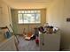 Utility room with window, washer, dryer, and general clutter at 240 N 4Th Ave, Brighton, CO 80601