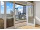 Balcony with a stunning cityscape view from floor-to-ceiling glass doors at 2020 Arapahoe St # 970, Denver, CO 80205