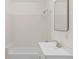 Bright, tiled bathroom with a shower-tub and a modern vanity at 2020 Arapahoe St # 970, Denver, CO 80205