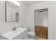 Tiled bathroom with modern vanity and view into another room at 2020 Arapahoe St # 970, Denver, CO 80205