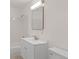 All-white bathroom with tiled shower and modern vanity at 2020 Arapahoe St # 970, Denver, CO 80205