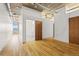 Spacious bedroom with hardwood floors and an en-suite bathroom at 2020 Arapahoe St # 970, Denver, CO 80205