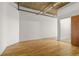 Minimalist bedroom with hardwood floors and neutral walls at 2020 Arapahoe St # 970, Denver, CO 80205