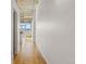 Hallway showcasing hardwood floors and access to additional rooms and a sunny window at 2020 Arapahoe St # 970, Denver, CO 80205