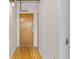 Hallway featuring hardwood floors and a solid wood front door at 2020 Arapahoe St # 970, Denver, CO 80205
