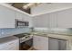 Kitchen with stainless steel appliances, ample counter space, and stylish backsplash at 2020 Arapahoe St # 970, Denver, CO 80205