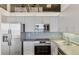 Kitchen with stainless steel appliances and backsplash at 2020 Arapahoe St # 970, Denver, CO 80205