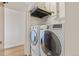 Modern laundry room featuring stacked washer and dryer units, maximizing space at 2020 Arapahoe St # 970, Denver, CO 80205