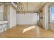 Spacious living room featuring hardwood floors and large windows for ample natural light at 2020 Arapahoe St # 970, Denver, CO 80205