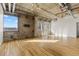 Spacious living room with hardwood floors, exposed ductwork, and great natural light at 2020 Arapahoe St # 970, Denver, CO 80205