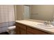 Bathroom with vanity, shower/tub combo, and a white sink at 27869 E 7Th Pl, Aurora, CO 80018