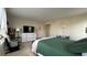 Main bedroom with a king bed, dresser, and calming green bedding at 27869 E 7Th Pl, Aurora, CO 80018