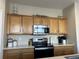 Bright kitchen featuring stainless steel appliances and ample cabinetry at 27869 E 7Th Pl, Aurora, CO 80018