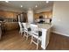 Kitchen with island and light wood cabinets at 27869 E 7Th Pl, Aurora, CO 80018