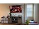 Living room with large TV and wood-look floors at 27869 E 7Th Pl, Aurora, CO 80018