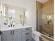 Modern bathroom with glass shower, gray vanity, and stylish fixtures at 6176 Oxford Peak Ln, Castle Rock, CO 80108