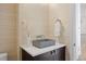 Modern powder room features vessel sink, unique decor, and sleek fixtures at 6176 Oxford Peak Ln, Castle Rock, CO 80108