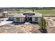 Stunning exterior view of a modern home with stone accents and a tile roof at 6176 Oxford Peak Ln, Castle Rock, CO 80108